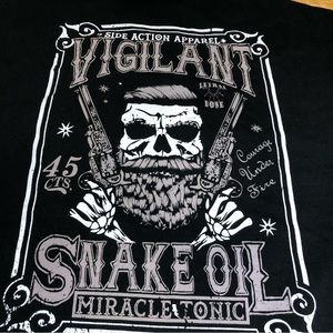 Large side action Apparel Vigilant Snake Oil tee.  law enforcement.